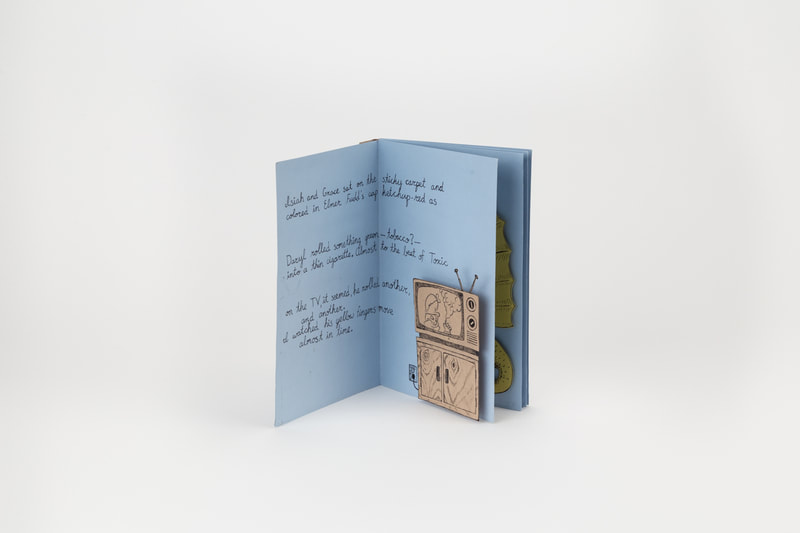 A pop-up book propped open. An illustration of a television set displays Elmer Fudd smoking a joint. A piece of a poem is handwritten beside the illustration.